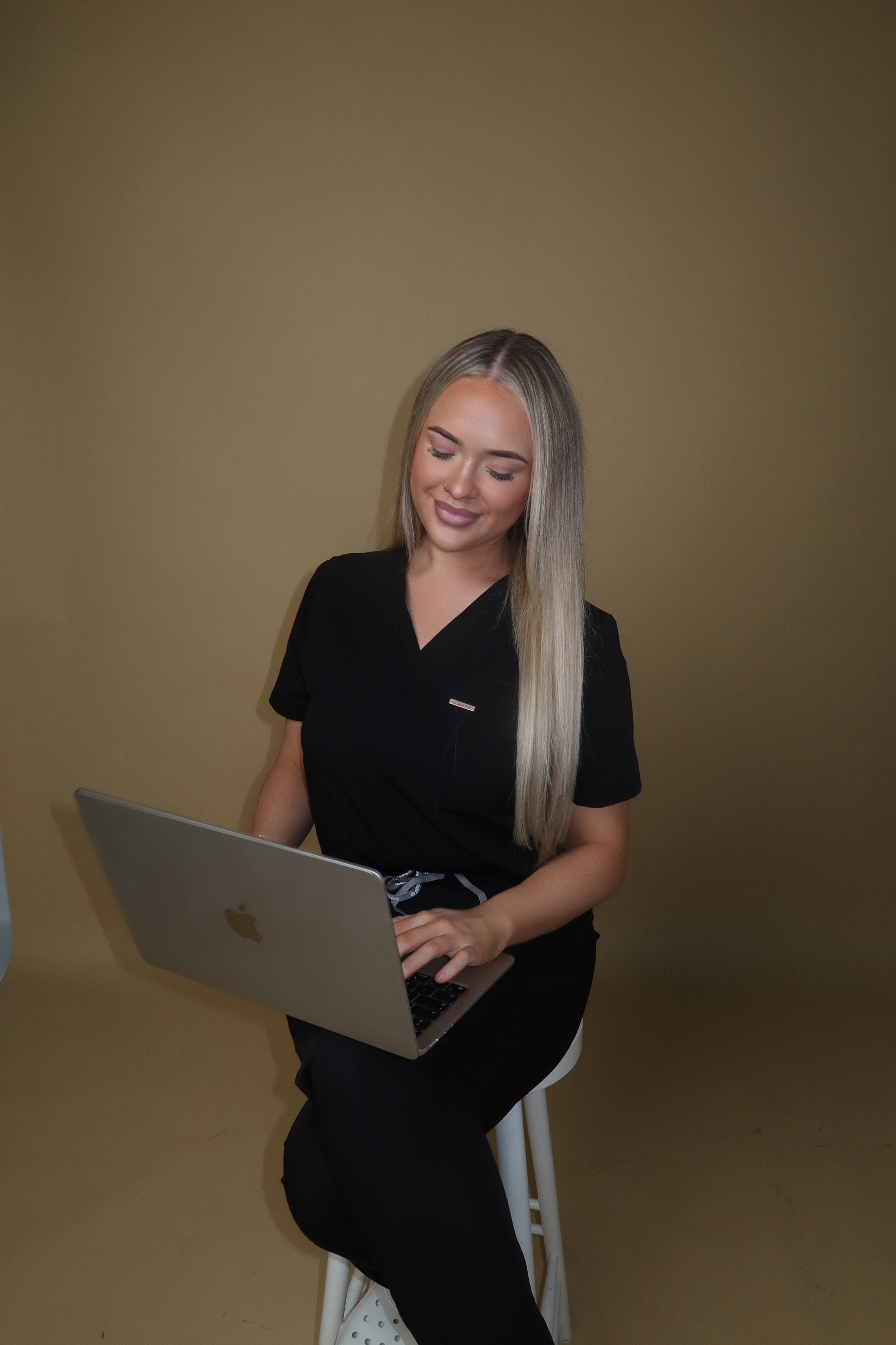 Olivia Stratton with a laptop